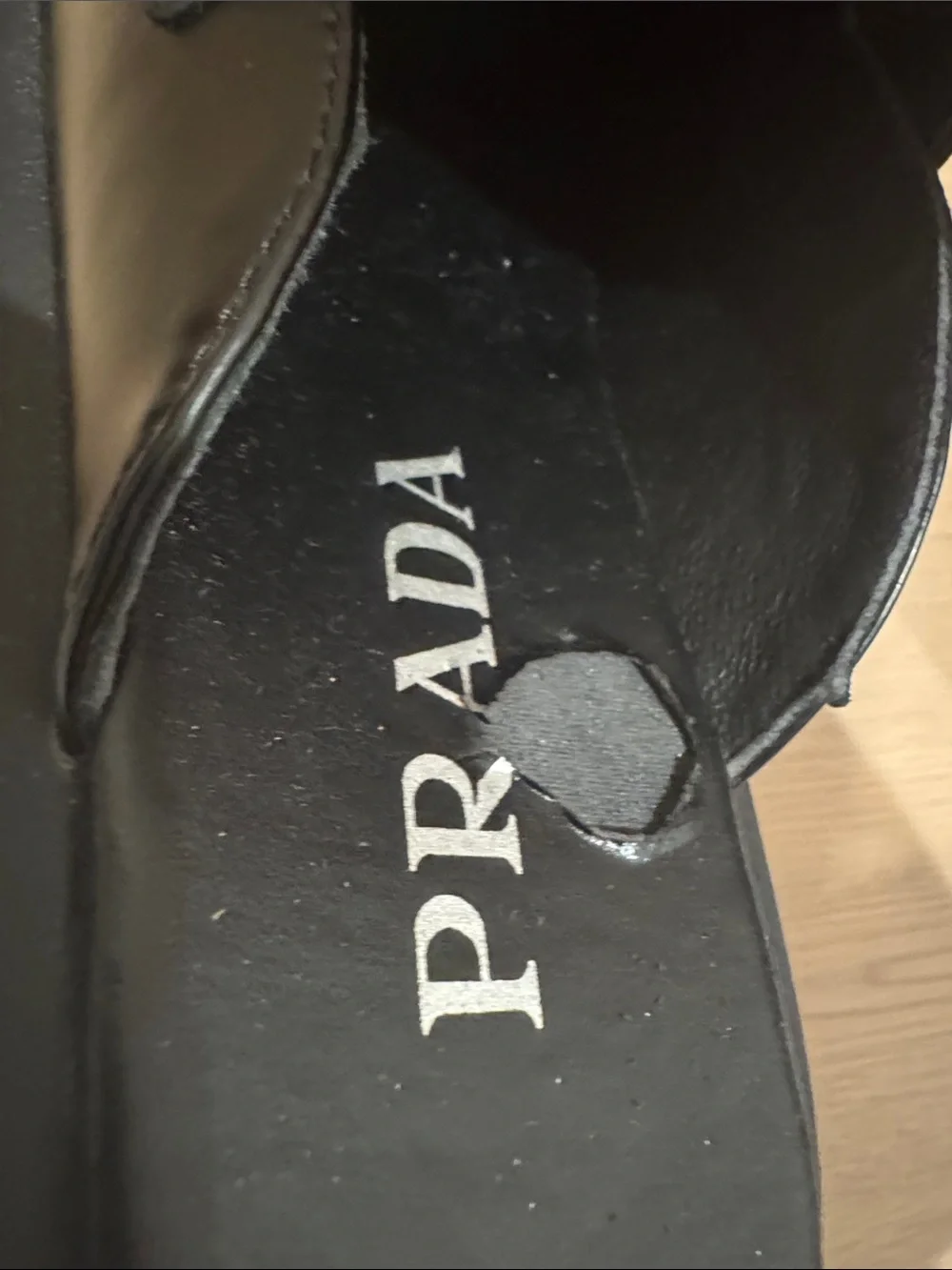 Prada women’s Black Leather Slide Loafers with Triangle Logo